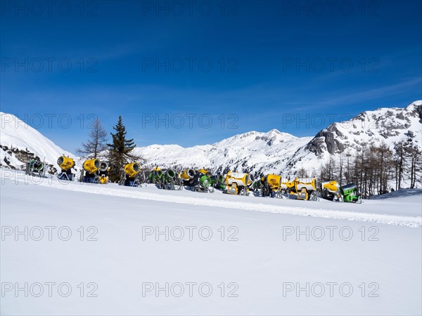 Snow cannons on a ski slope