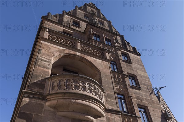 Gothic tracery of the balcony parapets of the historic Hotel Deutscher Kaiser