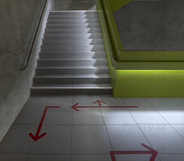 Directional arrows in the staircase of the city library