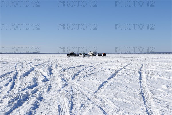 Tire tracks in snow on a frozen river