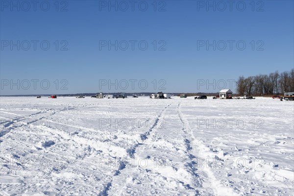 Tire tracks in snow on a frozen river