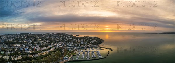 Panorama over Torquay and Torquay Marina from a drone in sunrise time