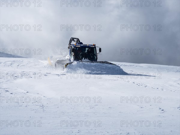 Snow groomer or Pistenbully levels ski slope