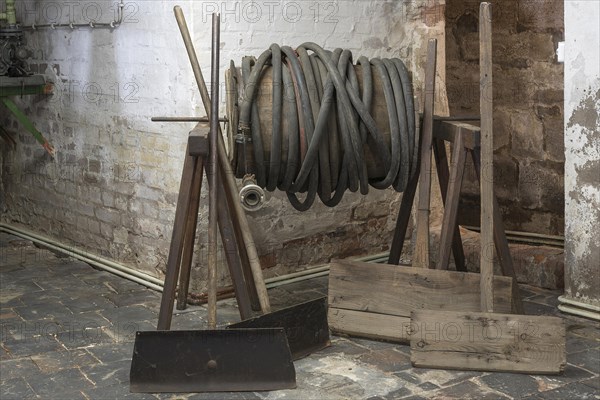 Coiled water hose in a former valve factory