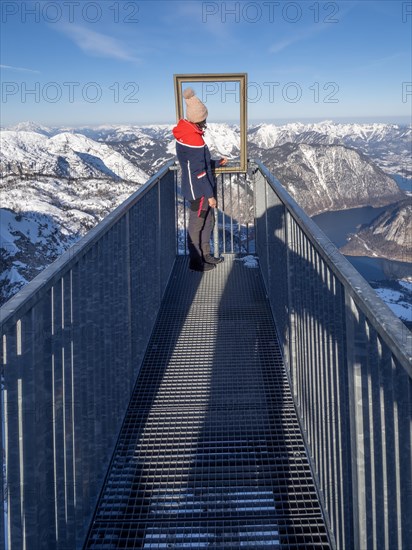 Tourist admires winter landscape at Five Fingers viewpoint