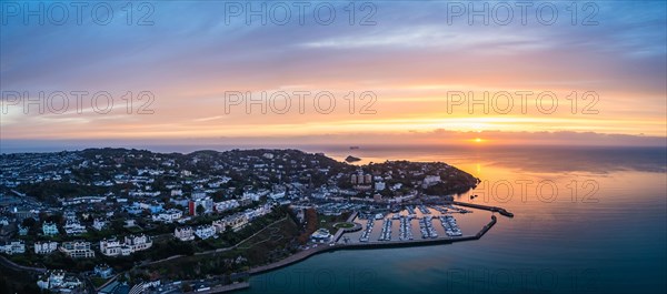 Panorama over Torquay and Torquay Marina from a drone in sunrise time