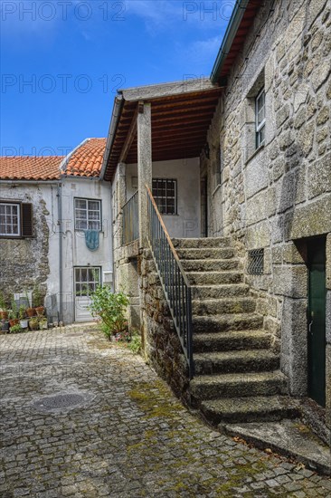 Narrow cobble street and old stone houses