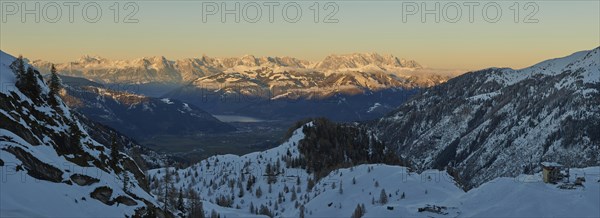 View from Mount Kitzsteinhorn on snow covered mountains down to Zell am See