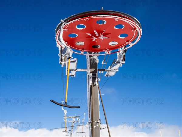 Blue sky above drag lift