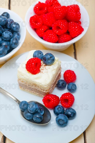 Fresh homemade raspberry and blueberry cream cake