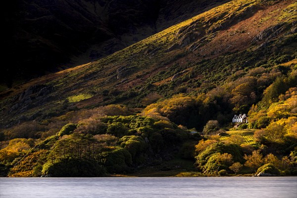 Villa on Lake Glenmore in autumnal landscape