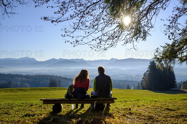 Hikers taking a break on a bench