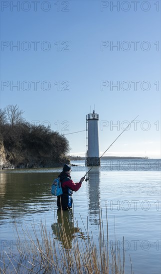 Anglers at the Maltzien lighthouse on the island of Ruegen