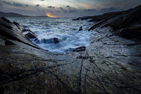 Sea surf on rocky coast