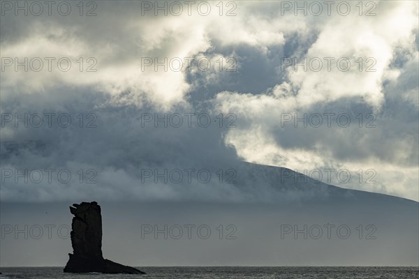 North Atlantic with rock needle and cloudy sky