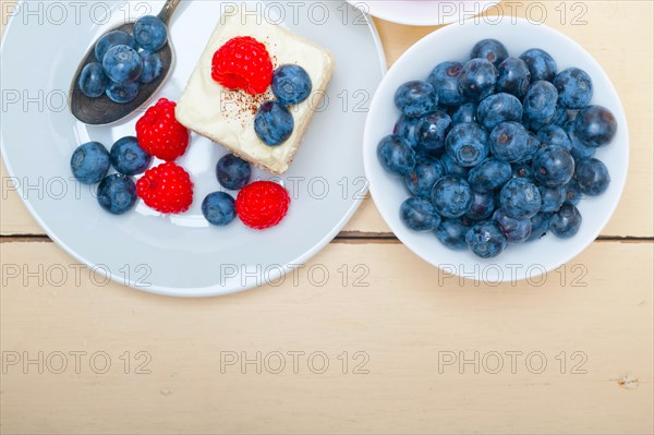 Fresh homemade raspberry and blueberry cream cake