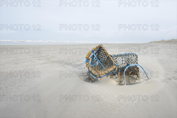 Washed-up fishing baskets on the beach