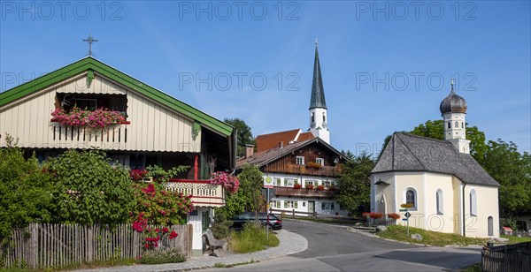 Tower of the Filial Church of the Assumption of the Virgin Mary next to the wayside chapel of Our Lady