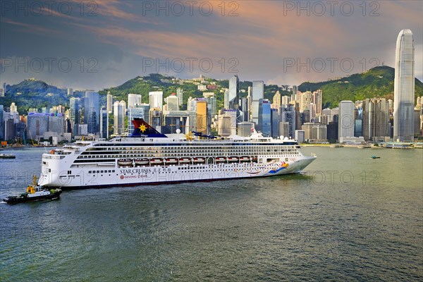Large cruise ship sails on the Hong Kong River in the early morning