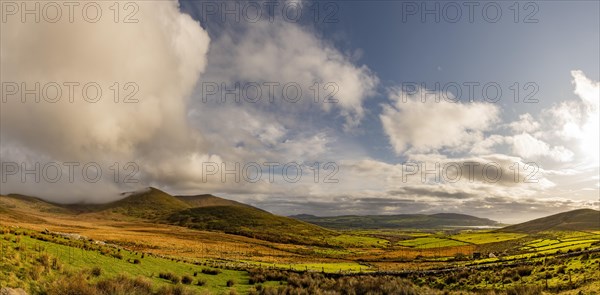 Autumn mountain landscape with cloudy sky