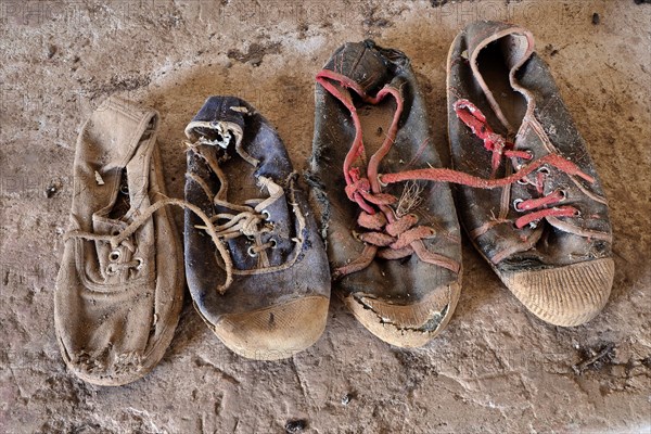 Rotten casual shoes on the floor