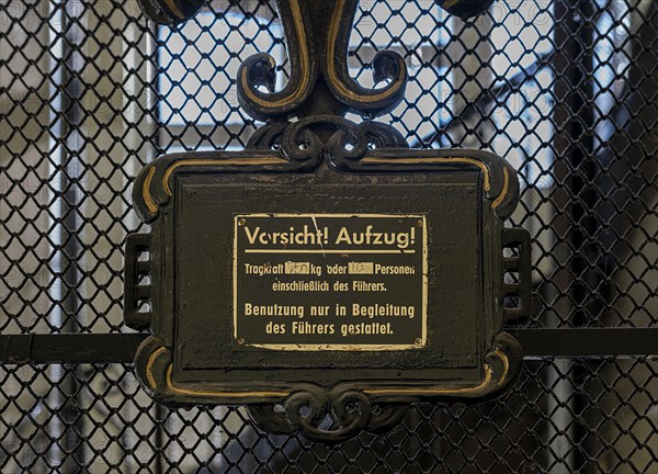 Warning sign from a historic lift in an old factory