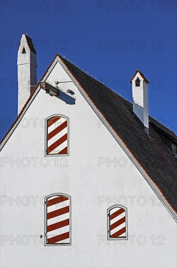 Pointed gable with chimneys