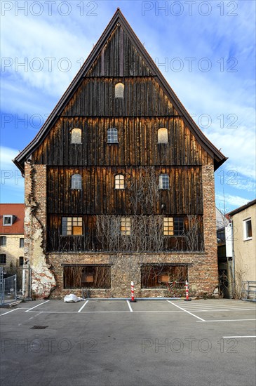 Charred board facade with brick wall