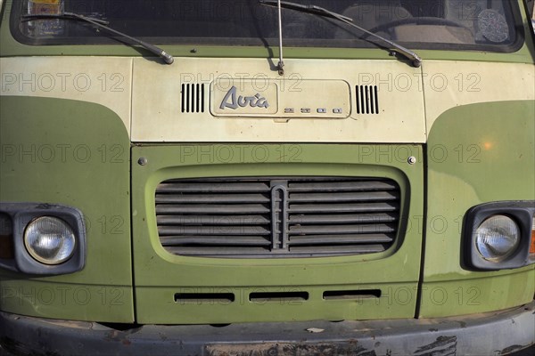 Front view of lime green Avia van