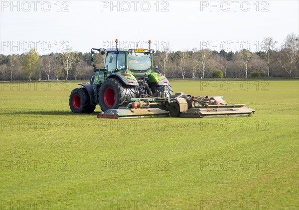 Fendt 313 tractor mowing grass