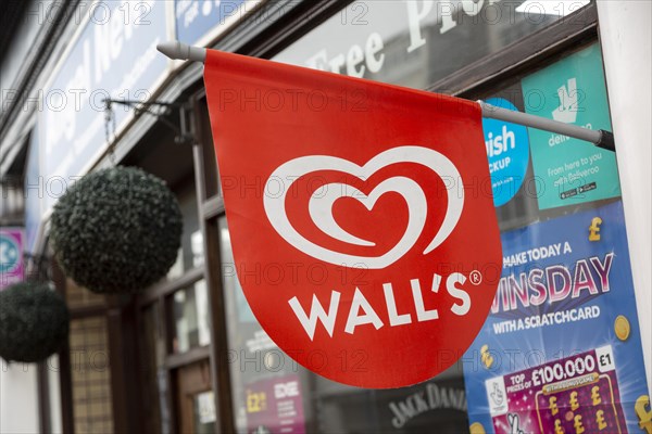 Wall's ice cream red sign outside newsagent shop