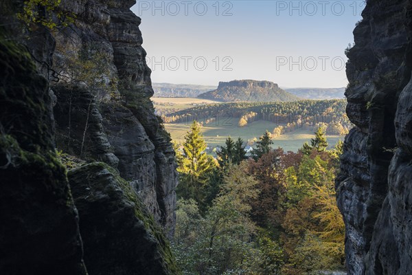 Narrow view between the rocks to the table mountain Lilienstein