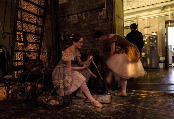 Ballet dancers in the wings preparing themselves to get onstage during the performance of Tchaikovsky s Swan Lake in St. Petersburg