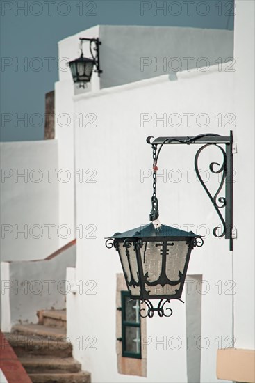 Classical street lamp on white wall