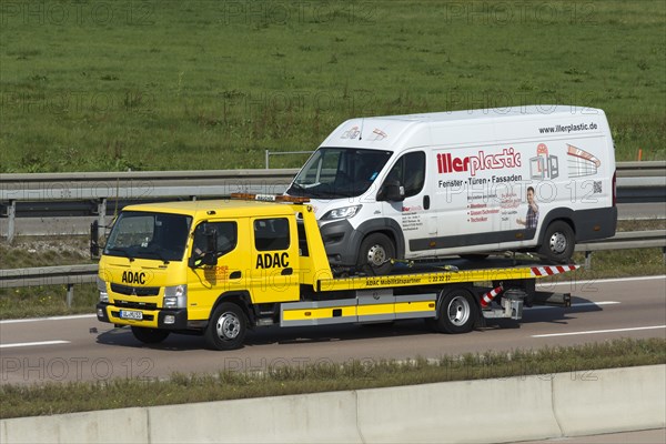 ADAC tow truck transports defective van on the A8 motorway