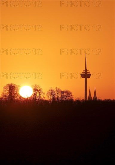 Sunrise over the city skyline with the Colonius telecommunications tower and the cathedral