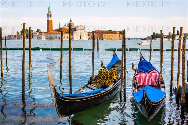 Gondolas in front of the evening panorama of San Giorgio Maggiore