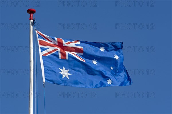 Australian flag against a blue sky