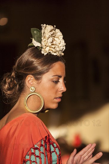 A young woman in traditional attire during the Feria de Abril in Seville