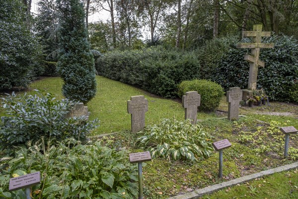 Gravestones for unknown Russian soldiers and orthodox Russian cross at the cemetery for Soviet prisoners of war from WW2