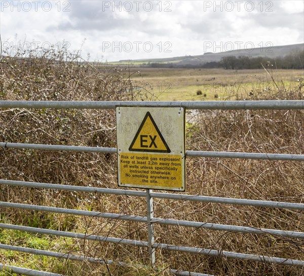 Sign warning of danger of gas explosion at landfill site