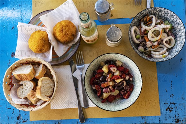 Seafood salad and arancine