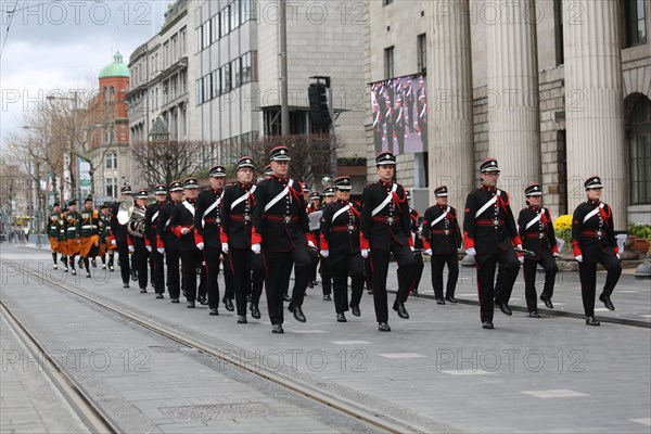 Marching band passes the General Post Office in OConnell Street during Easter 1916 commemorations. Dublin