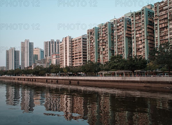 Tall buildings by the sea with reflections in Macau