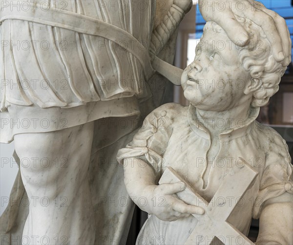 Marble statue of an ancient warrior with child in the staircase of the Humboldt Forum