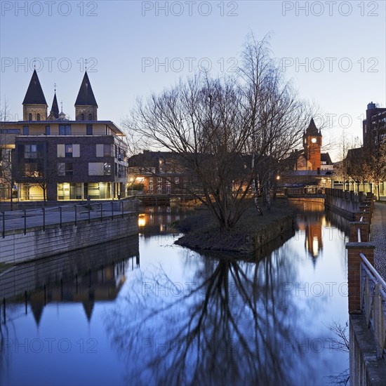 St. Anthony's Parish Church and Old Town Hall Tower with the River Dinkel in the Evening