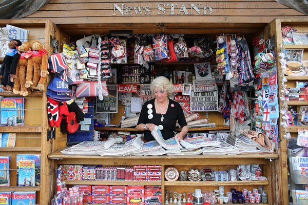 Female stallowner arranges newspapers day after Brexit decision. Westminster