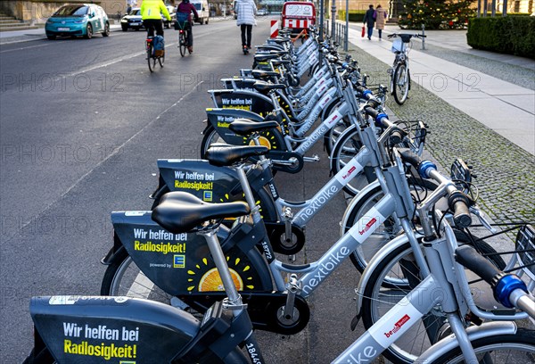 Electric rental bikes at the charging station in front of the Berlin House of Representatives