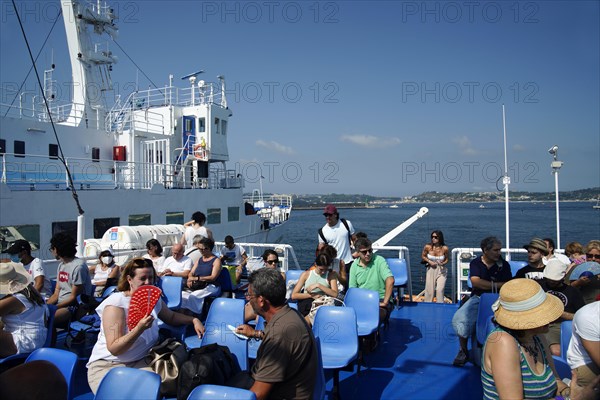 Tourists on the ferry to Procida