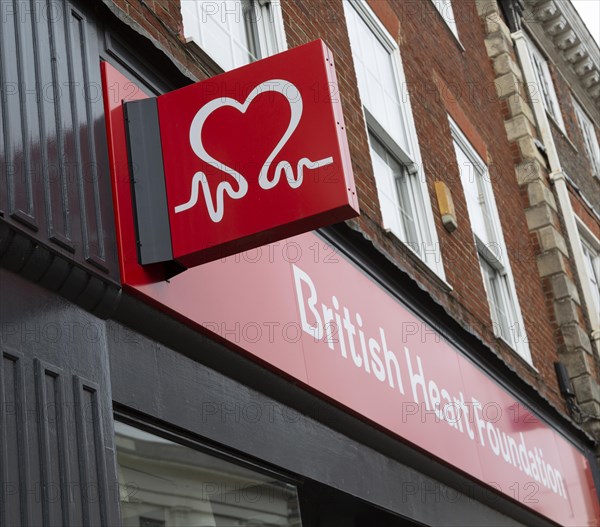 Wall mounted sign outside British Heart Foundation charity shop